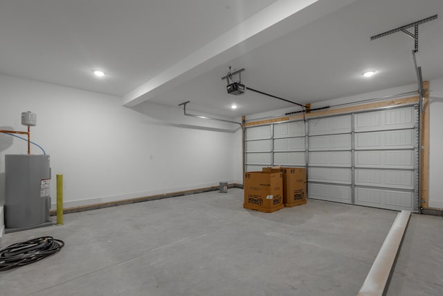 garage featuring electric water heater and a garage door opener