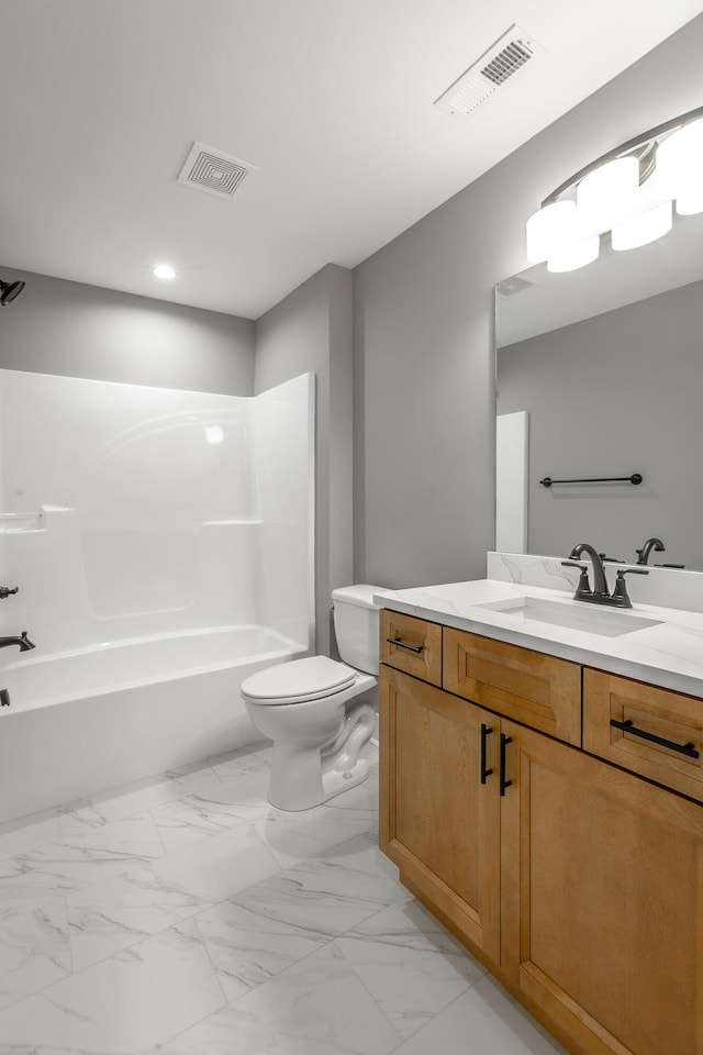 full bathroom featuring toilet, vanity, and shower / bathtub combination