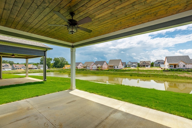 view of patio / terrace with a water view and ceiling fan