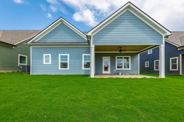 view of front of house featuring central air condition unit, a patio area, a front yard, and ceiling fan