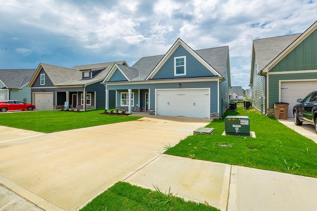 craftsman house with a garage, a front lawn, and a porch