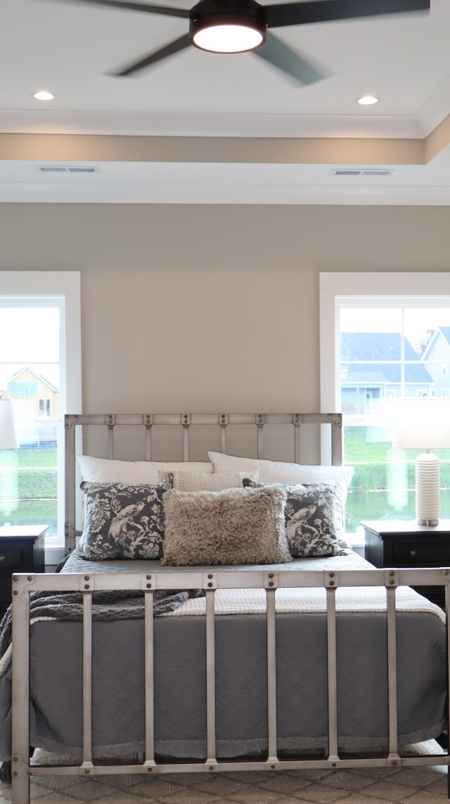 bedroom featuring ceiling fan and crown molding