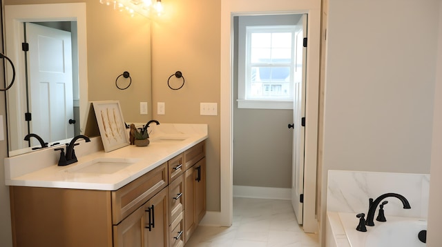 bathroom with vanity and a bath