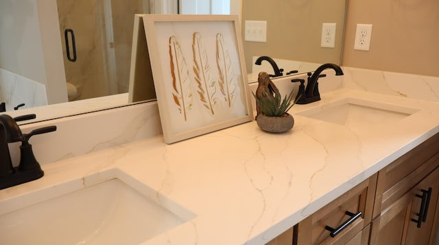 bathroom featuring an enclosed shower and vanity