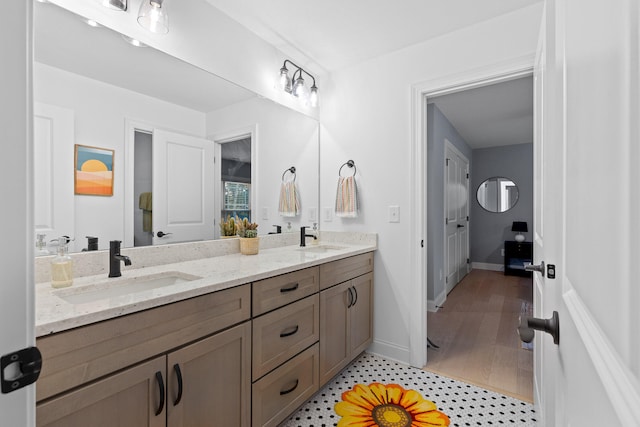 bathroom with vanity and wood-type flooring