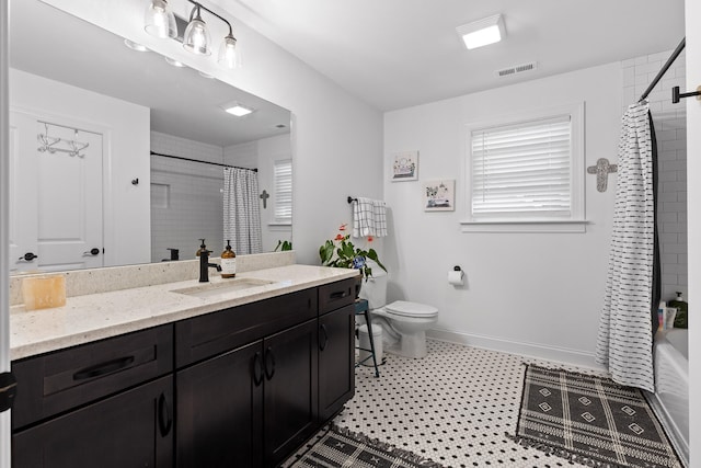 full bathroom with vanity, toilet, and shower / bath combo