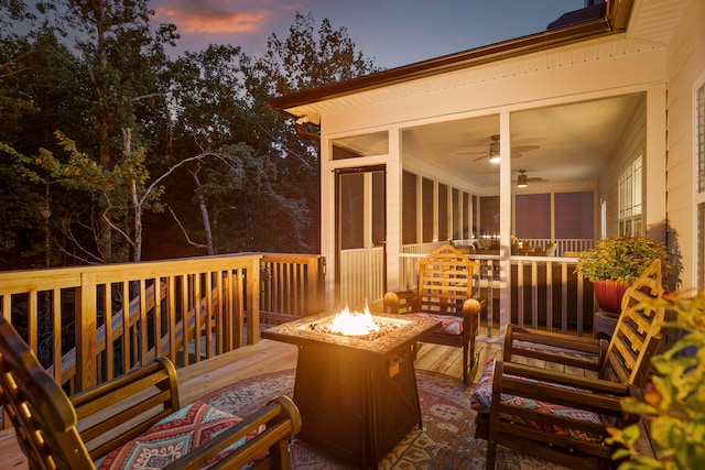 deck at dusk with an outdoor fire pit