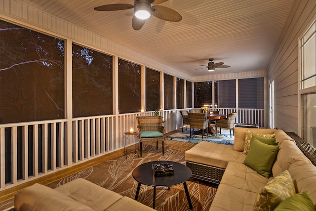 sunroom / solarium with ceiling fan and wooden ceiling