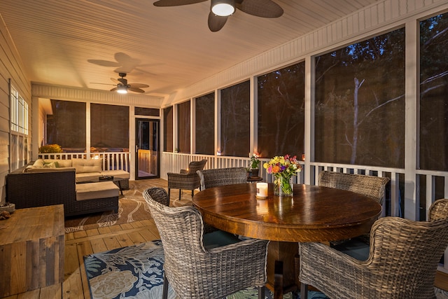 sunroom with ceiling fan and wood ceiling