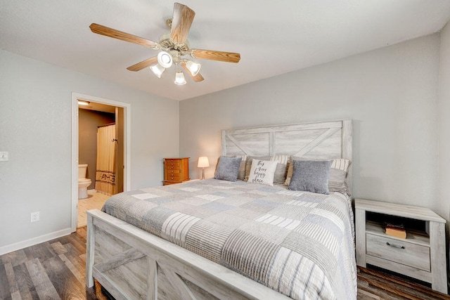 bedroom featuring connected bathroom, dark hardwood / wood-style flooring, and ceiling fan