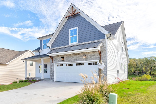 craftsman-style house featuring a garage and a front lawn