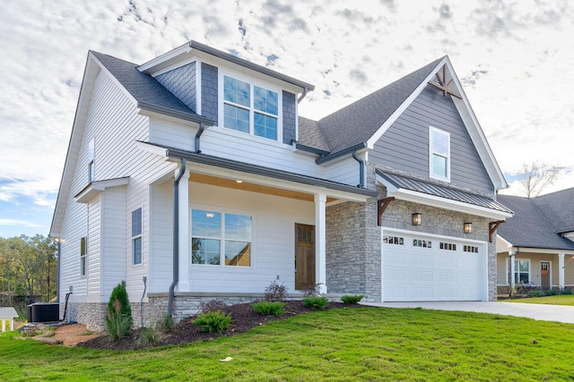 craftsman inspired home featuring central air condition unit, a front lawn, and a garage