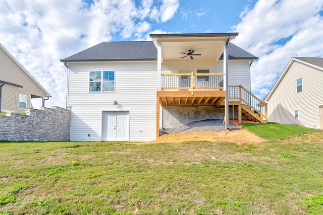 back of house with ceiling fan, a lawn, and a wooden deck