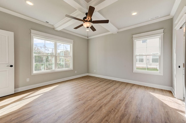 spare room featuring beamed ceiling, light hardwood / wood-style flooring, ceiling fan, and crown molding