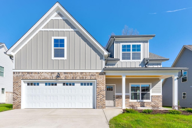 view of front of property featuring covered porch and a garage