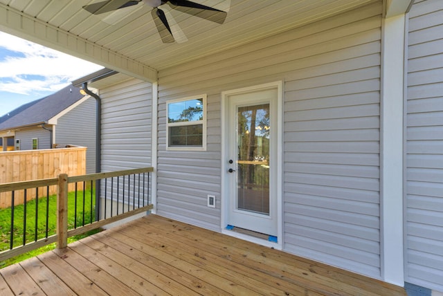 wooden deck featuring ceiling fan