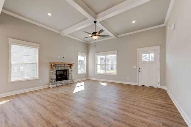 unfurnished living room with hardwood / wood-style floors, ceiling fan, a fireplace, and coffered ceiling