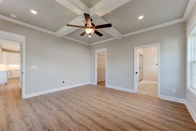 unfurnished bedroom with beamed ceiling, ceiling fan, light hardwood / wood-style floors, and a walk in closet