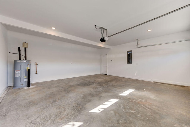 garage featuring water heater and a garage door opener