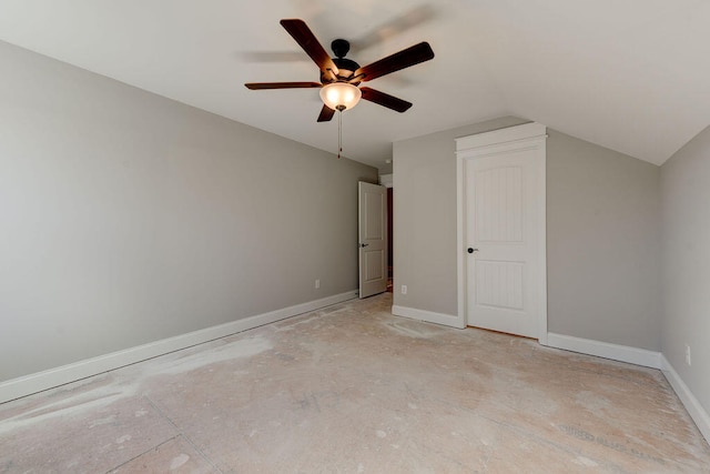 unfurnished bedroom with ceiling fan and lofted ceiling