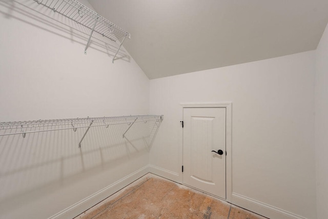 spacious closet featuring vaulted ceiling