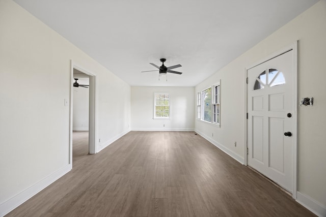 foyer entrance featuring ceiling fan and dark hardwood / wood-style floors