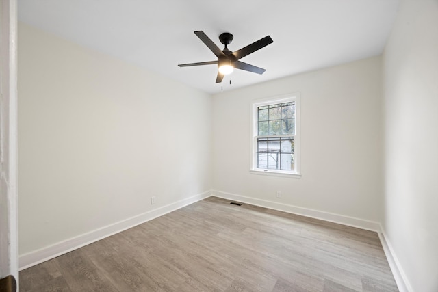 unfurnished room featuring ceiling fan and light wood-type flooring