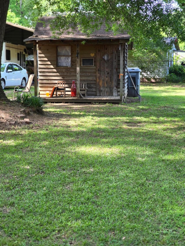 view of outdoor structure with a yard