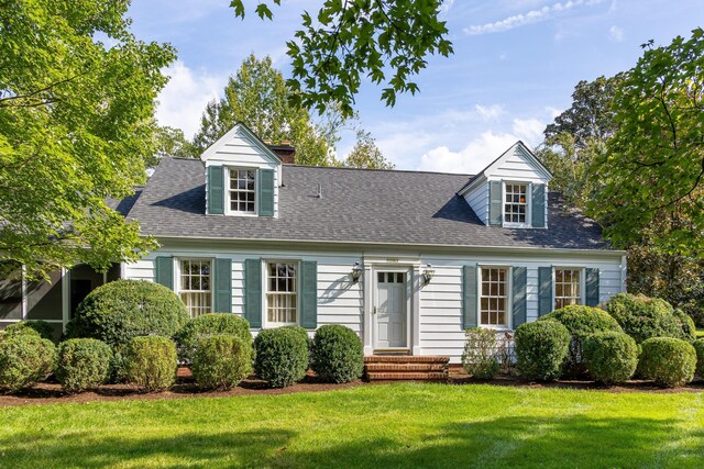 2050 Harle Ave NW, Cleveland, TN 37311 - new england style home with a chimney, a front lawn, and roof with shingles