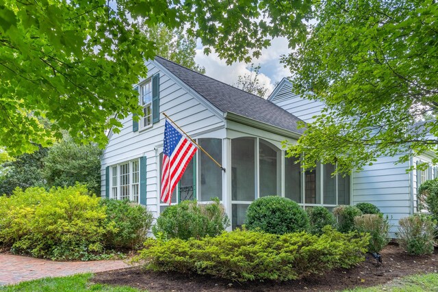 2050 Harle Ave NW, Cleveland, TN 37311 - view of side of property with a sunroom and roof with shingles