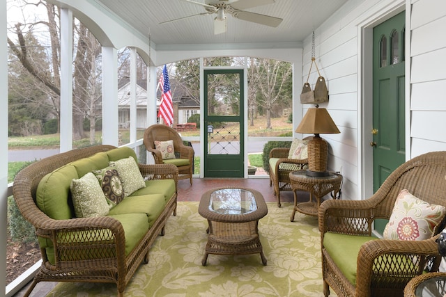 sunroom featuring ceiling fan