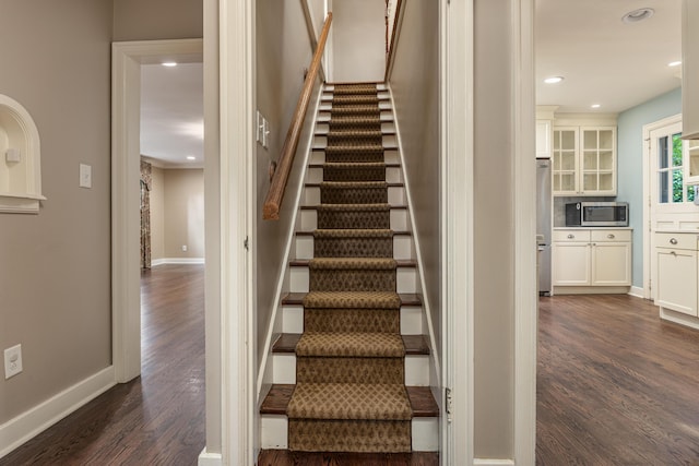 stairway featuring hardwood / wood-style flooring