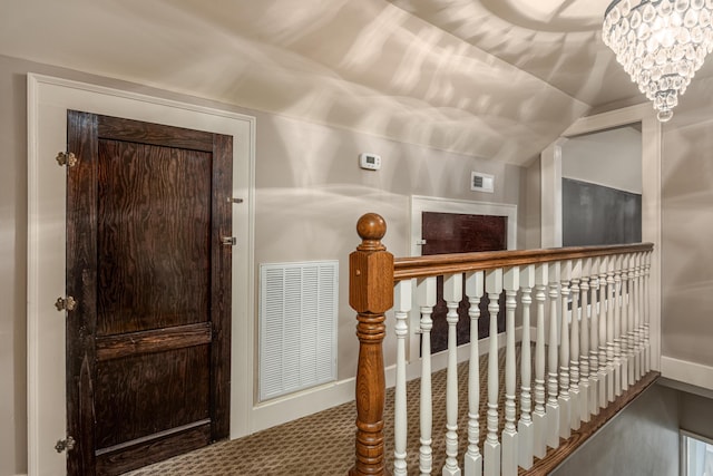 interior space featuring a notable chandelier and lofted ceiling