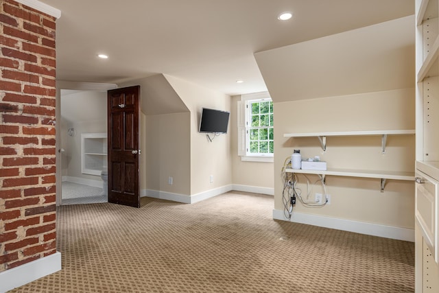 bonus room with light colored carpet