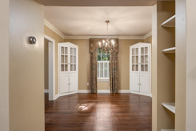 unfurnished dining area with ornamental molding, a notable chandelier, and dark hardwood / wood-style flooring