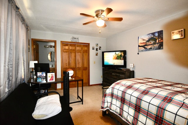 carpeted bedroom featuring a textured ceiling, ceiling fan, and a closet