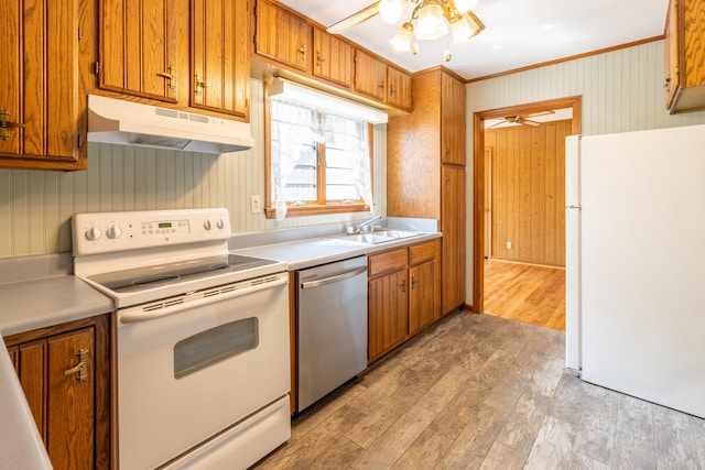 kitchen featuring white appliances, ceiling fan, and light hardwood / wood-style flooring