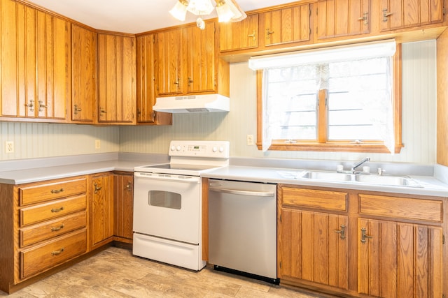 kitchen featuring ceiling fan, sink, stainless steel dishwasher, electric range, and light wood-type flooring