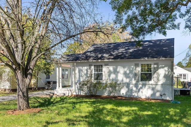 bungalow-style house with a front lawn