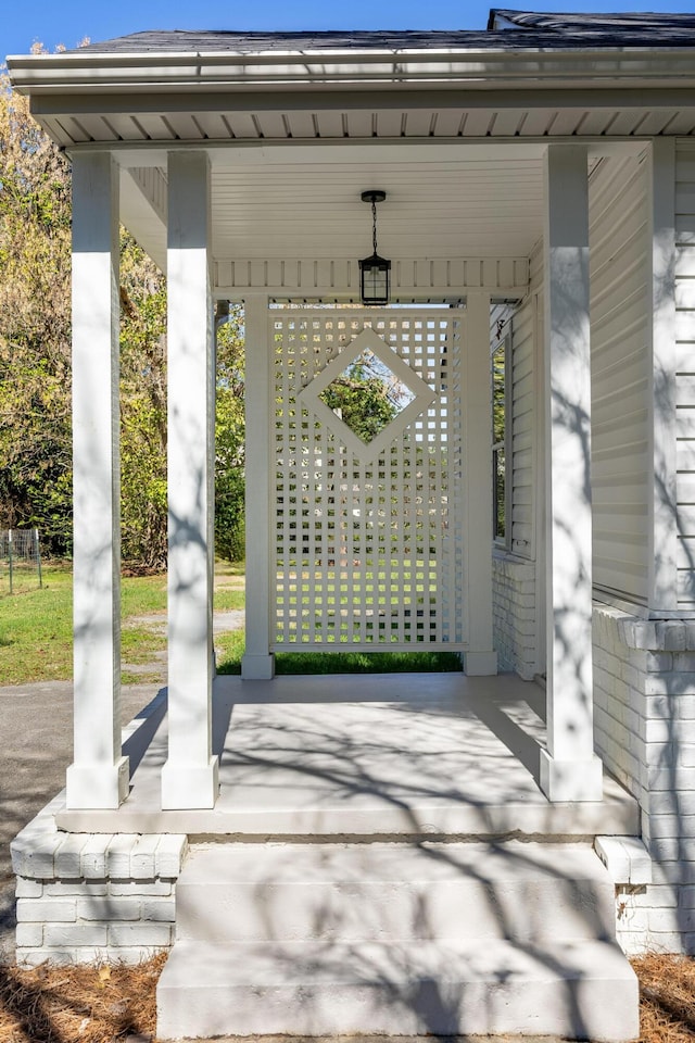 view of exterior entry featuring a porch