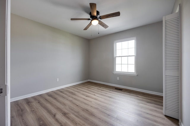 unfurnished bedroom featuring light hardwood / wood-style floors and ceiling fan