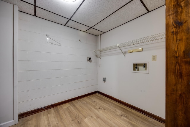 washroom with hookup for an electric dryer, hardwood / wood-style floors, and washer hookup