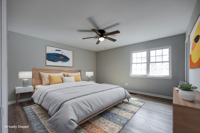 bedroom with hardwood / wood-style flooring and ceiling fan