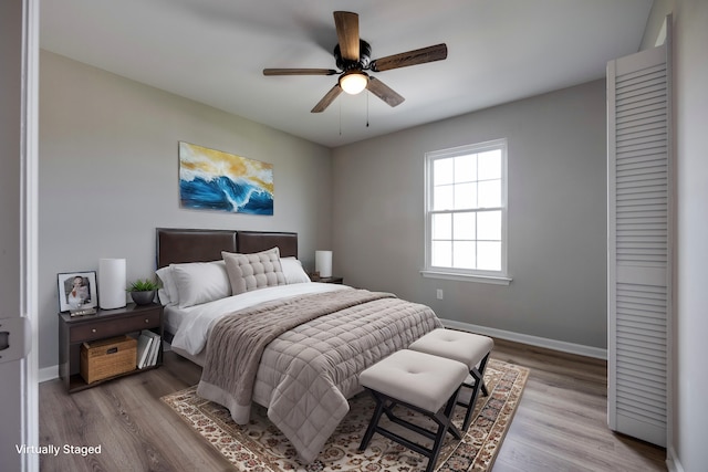 bedroom featuring ceiling fan and hardwood / wood-style flooring