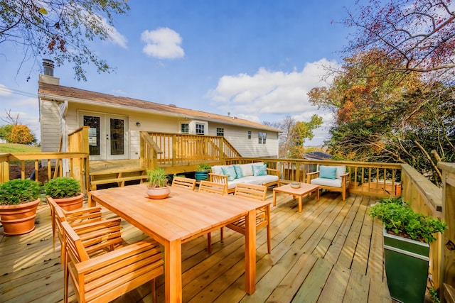 wooden deck with outdoor lounge area and french doors