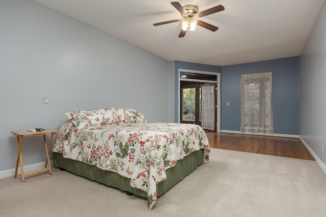 bedroom with ceiling fan and hardwood / wood-style flooring