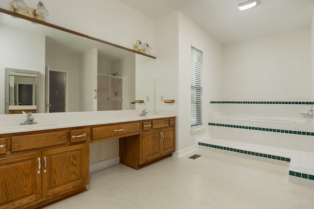 bathroom with shower with separate bathtub and vanity