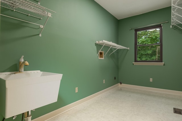 laundry room with hookup for a washing machine and sink