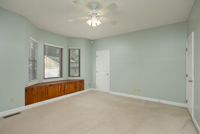 unfurnished bedroom with carpet flooring and ceiling fan