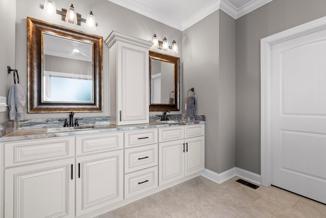 bathroom featuring crown molding and vanity